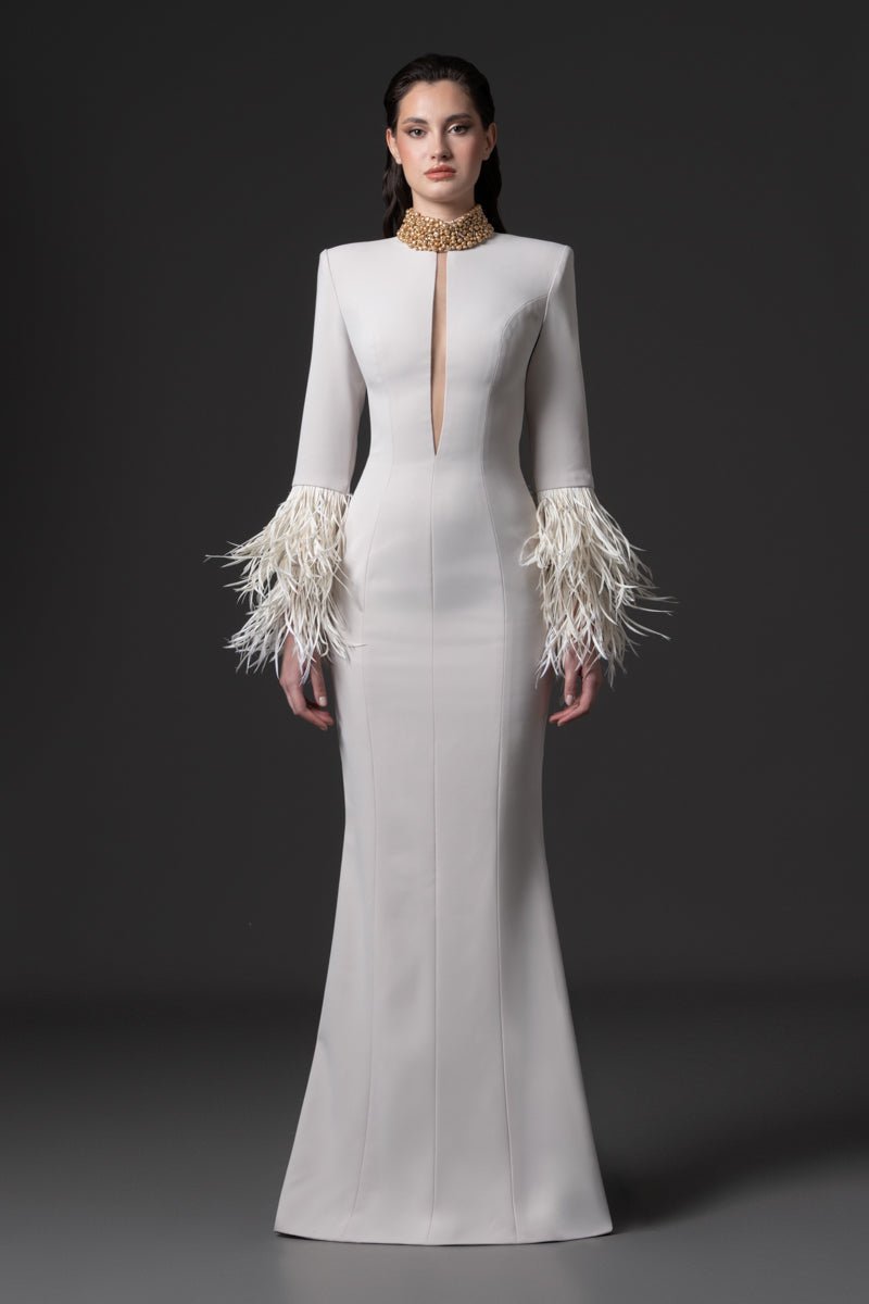 A fitted long sleeves dress with a beaded collar, a deep vertical opening
