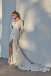 HerTrove-Column white gown with plunging neckline and dramatic train