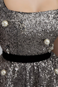 HerTrove-A sequined crystal evening dress with tulle, lace circles, and crystal and pearl brooches.