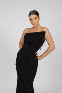 HerTrove-A long black crepe dress with a diagonal neckline and crystals.