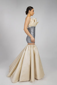 HerTrove-An evening dress made of shiny sequins and crepe, adorned with feathers and crystals.