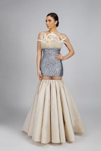 HerTrove-An evening dress made of shiny sequins and crepe, adorned with feathers and crystals.