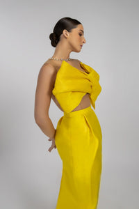 HerTrove-A long yellow taffeta evening dress with a modern design featuring a large bow and a transparent back.