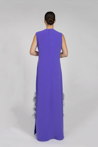 HerTrove-A long crepe dress with a straight cut, featuring feather and hand-embroidered crystal embellishments at the bottom.