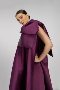HerTrove-A long modern dress made of taffeta, with a wide and flowing silhouette.