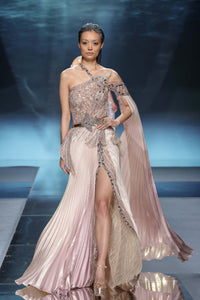 Embroidered gown with one sheer sleeve and illusion neckline