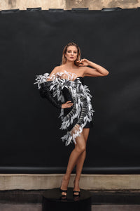 A jet black sequin corseted mini dress with structured sleeve - HerTrove