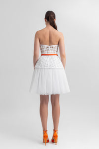 Strapless corset-like top, paired with an A-line gathered tulle skirt and a detachable belt. - HerTrove