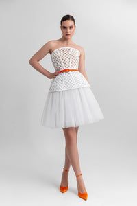 Strapless corset-like top, paired with an A-line gathered tulle skirt and a detachable belt. - HerTrove