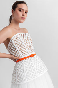 Strapless corset-like top, paired with an A-line gathered tulle skirt and a detachable belt. - HerTrove