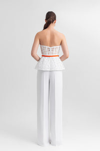 Strapless corset-like top, paired with straight-cut crepe pants and a detachable belt. - HerTrove