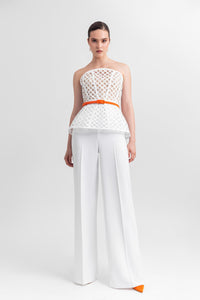 Strapless corset-like top, paired with straight-cut crepe pants and a detachable belt. - HerTrove