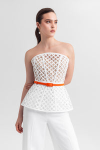 Strapless corset-like top, paired with straight-cut crepe pants and a detachable belt. - HerTrove