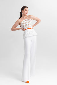 Strapless corset-like top, paired with straight-cut crepe pants and a detachable belt. - HerTrove
