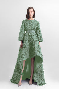 Laser-cut top with open-sleeve details, paired with a wide asymmetrical hemline laser-cut skirt and a detachable belt. - HerTrove