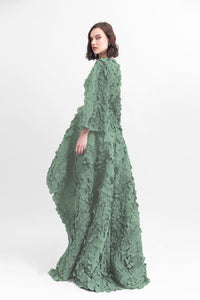 Laser-cut top with open-sleeve details, paired with a wide asymmetrical hemline laser-cut skirt and a detachable belt. - HerTrove